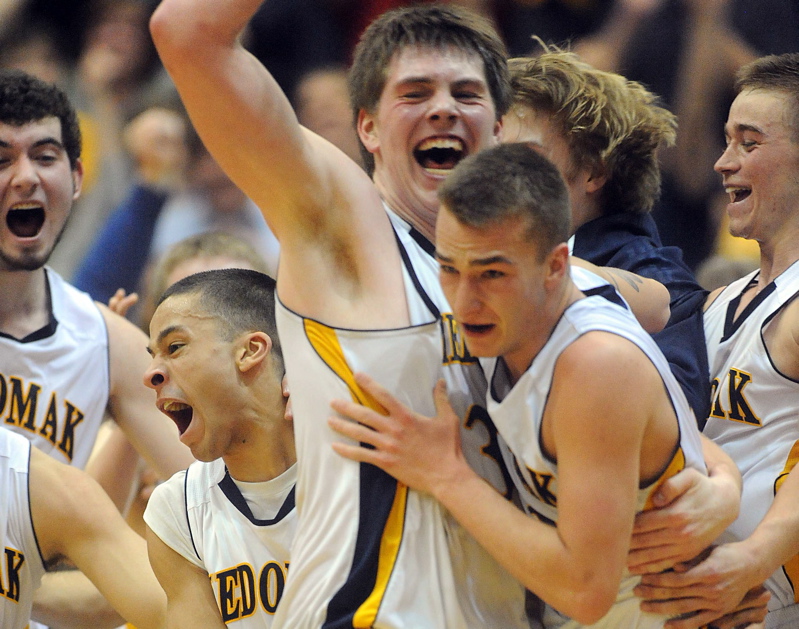Medomak Valley celebratesits win over MDI in the Eastern Class B championship game at the Bangor Auditorium Saturday.
