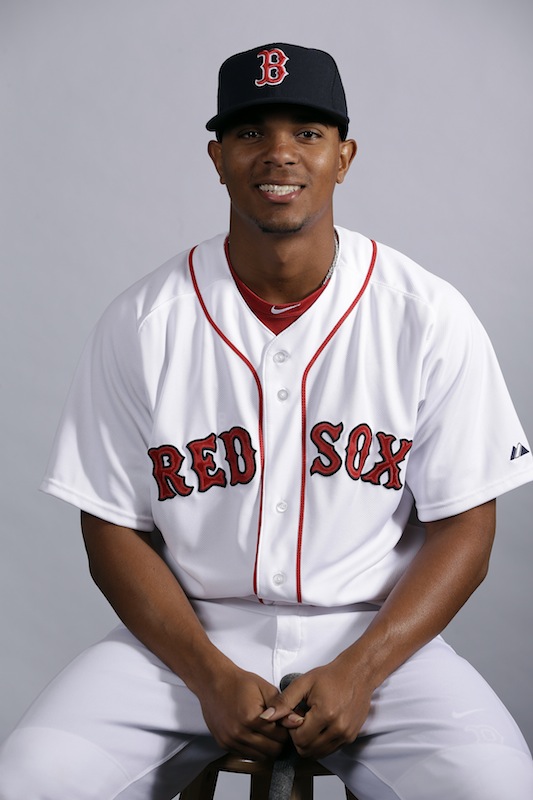 This Feb. 17, 2013 file photo shows Boston Red Sox's Xander Bogaerts posing during team photo day in Fort Myers, Fla. Bogaerts, Boston's top prospect, is chugging away at his first spring training, doing whatever he can to impress staff and teammates. Either way, though, he'll soon be headed out of town. (AP Photo/Chris O'Meara, File)