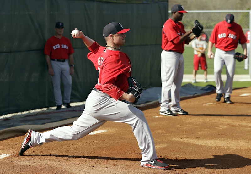 Boston Red Sox pitcher Jon Lester, front, throws a bullpen session during spring training Wednesday, Feb. 13, 2013, in Fort Myers, Fla. (AP Photo/Chris O'Meara)