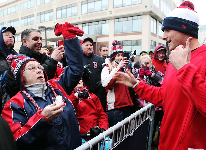 Boston Red Sox third baseman Will Middlebrooks greets fans outside Fenway Park on Tuesday, Feb. 5, 2013, in Boston. Red Sox fans turned out for 'Truck Day' at Fenway, the day the team sends off its equipment to Florida in preparation for spring training. Pitchers and catchers formally report to spring training a week from today but already, some players have been working out in Fort Myers. (AP Photo/The Boston Herald, Angela Rowlings) Fenway Park;Truck Day;Spring training;Boston Red Sox