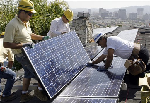 Installers Arin Gharibian, left, Hayk Mkrtchayan, center, and team leader Edward Boghosian, all employees of California Green Design, assemble solar electrical panels on the roof of a home in Glendale, Calif., in 2010. Fueled partly by billions of dollars in government incentives, the solar panel industry is creating millions of solar panels each year and, in the process, millions of pounds of polluted sludge and contaminated water.