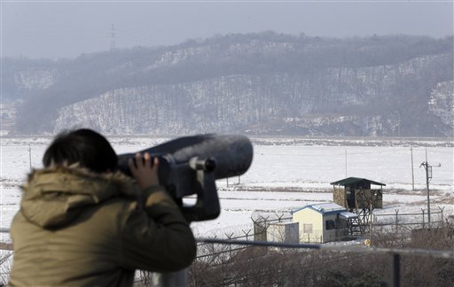 A visitor looks through binoculars Wednesday at Imjingak Pavilion near the border village of Panmunjom, which has separated the two Koreas since the Korean War. Defying U.N. warnings, North Korea on Tuesday conducted its third nuclear test in the remote, snowy northeast, taking a crucial step toward its goal of building a bomb small enough to be fitted on a missile capable of striking the United States.