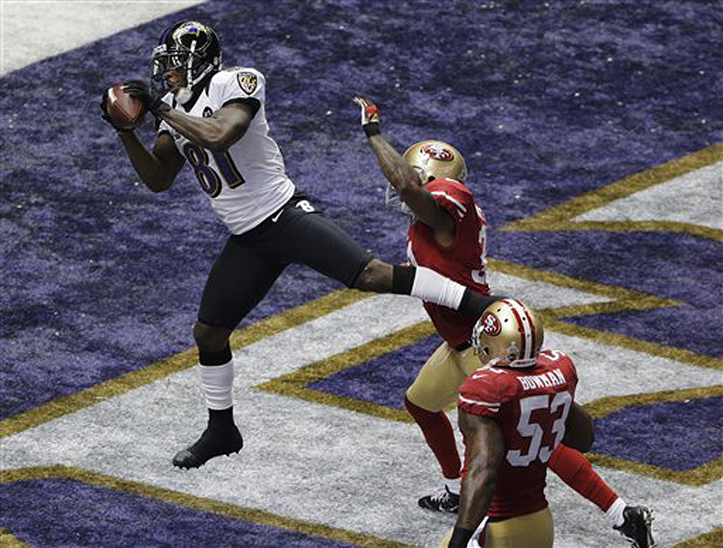 Baltimore Ravens wide receiver Anquan Boldin (81) catches a 13-yard pass for a touchdown as San Francisco 49ers linebacker NaVorro Bowman (53) trails the play during the first quarter of Super Bowl XLVII on Sunday. The game is being played in New Orleans.
