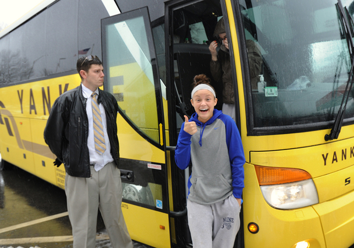 Members of the University of Maine women's basketball team stop at the Kennebunk rest area on the Maine Turnpike on their return to Orono following a bus accident in Massachusetts Tuesday evening. Brittany Wells, a freshman guard from Fishers, Ind., gives the thumbs up sign as she left the bus. At left is Yankee Lines bus driver Jason Stirk.