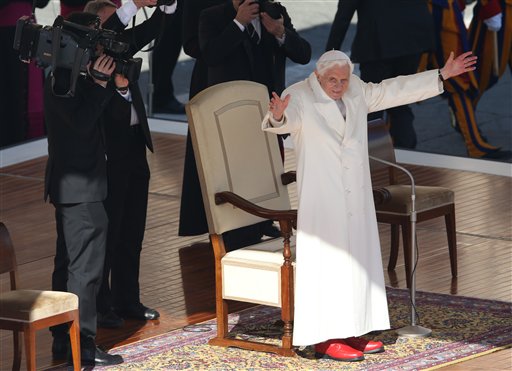 Pope Benedict XVI waves to pilgrims in St. Peter's Square at the Vatican on Wednesday after making several rounds of the square as crowds cheered wildly.