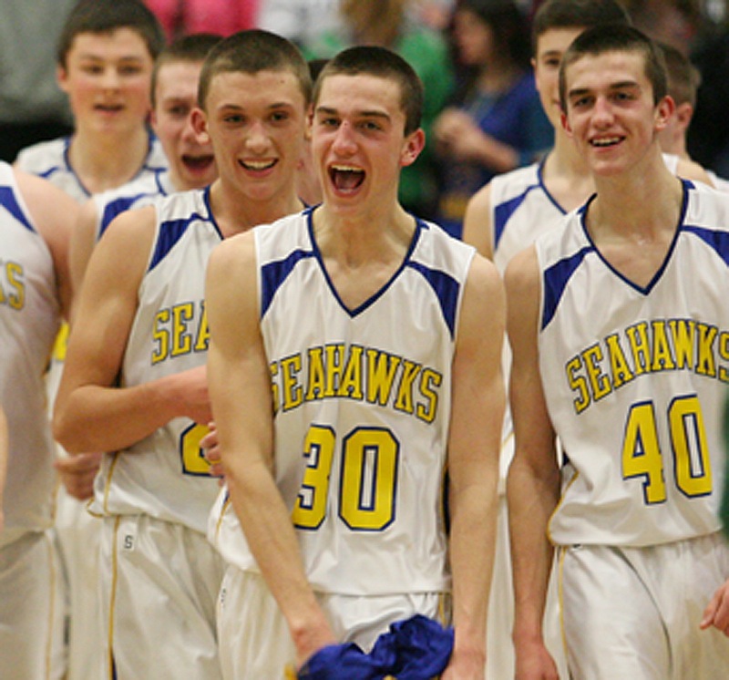Evan Hepburn, center, and John Hepburn, right, will be in the Class C state championship game after helping Boothbay beat Waynflete 70-52 in the regional final Saturday night.