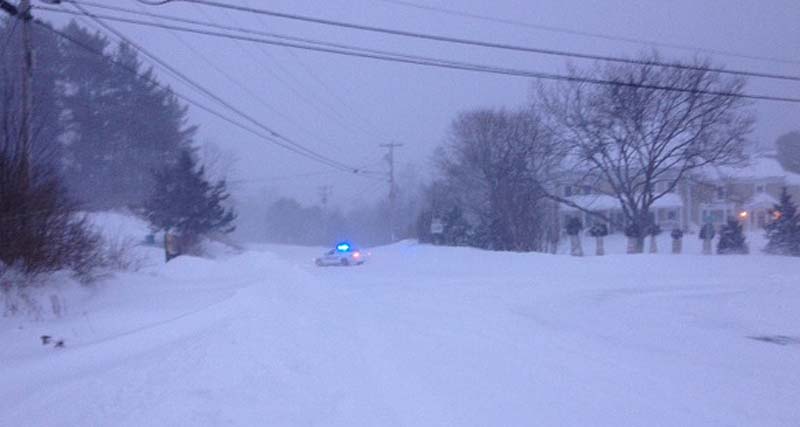 Gorham police block the intersection of State Road 114 and Huston Road at 6:30 a.m. Saturday due to a slideoff farther north on 114.