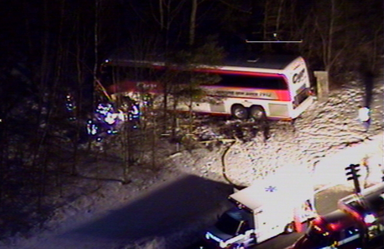 This photo of the bus crash scene Tuesday night in Georgetown, Mass., was taken from a Massachusetts State Police helicopter.