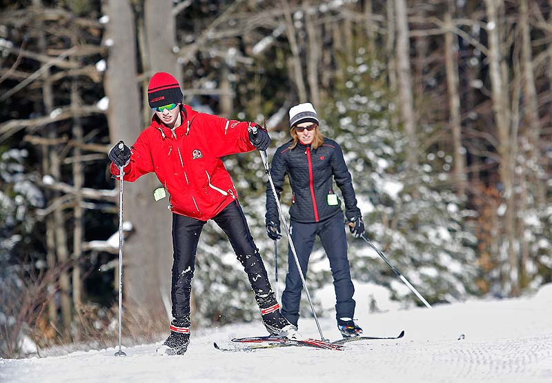 Liam Bridgham of Scarborough skis with his mother, Kim, Sunday at Pineland Farms in New Gloucester.