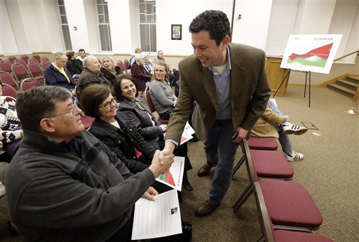 In this Feb. 7, 2013 photo, Rep. Jason Chaffetz, R-Utah, shakes hands with Richard Hart before a town hall meeting in Heber City, Utah. Chaffetz flew home from Washington last week to attend the town hall meeting. Many voters here and in similar communities elsewhere still want to do whatever it takes to stop President Obama, and the politicians they elect are listening. (AP Photo/Rick Bowmer)