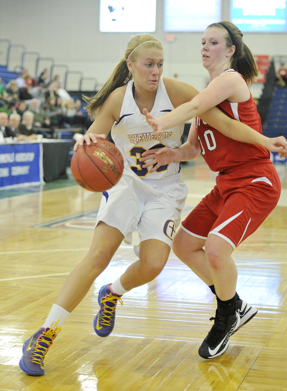Kylie Libby of Cheverus looks to drive past Samantha Adams of Sanford during their quarterfinal. Cheverus advanced with a 31-26 victory.