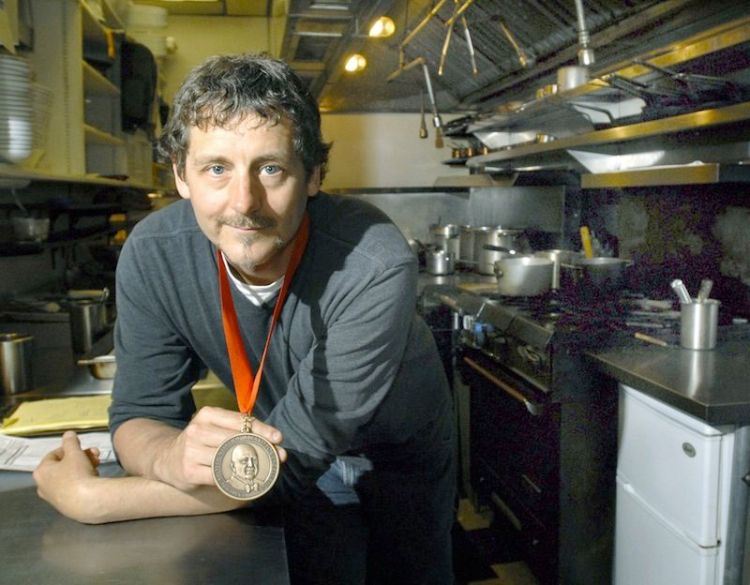Chef Rob Evans, the owner of Duckfat and former owner of Hugo’s in Portland, holds his 2009 James Beard Foundation best chef award.