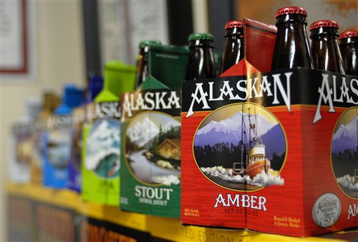 In this photo taken Jan 23, 2013, in Juneau, Alaska, are six-packs of beer displayed at the Alaskan Brewing Co. The brewery has installed a unique boiler system that burns the company's spent grain the accumulated waste from the brewing process into steam which powers the majority of the plant's operations. (AP Photo/Joshua Berlinger)