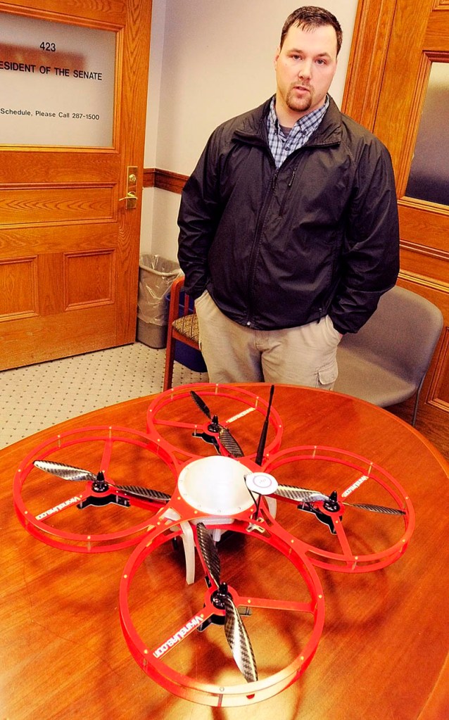 Christopher Taylor, president and drone designer for Viking Unmanned Aerial Systems, of Limington, talks about his company's FR-Xtreme drone model, which is on table, on Tuesday at the State House in Augusta.The company's website calls it a "Vertical Take-Off and Landing Commercial Quad Copter built to serve multiple industries."