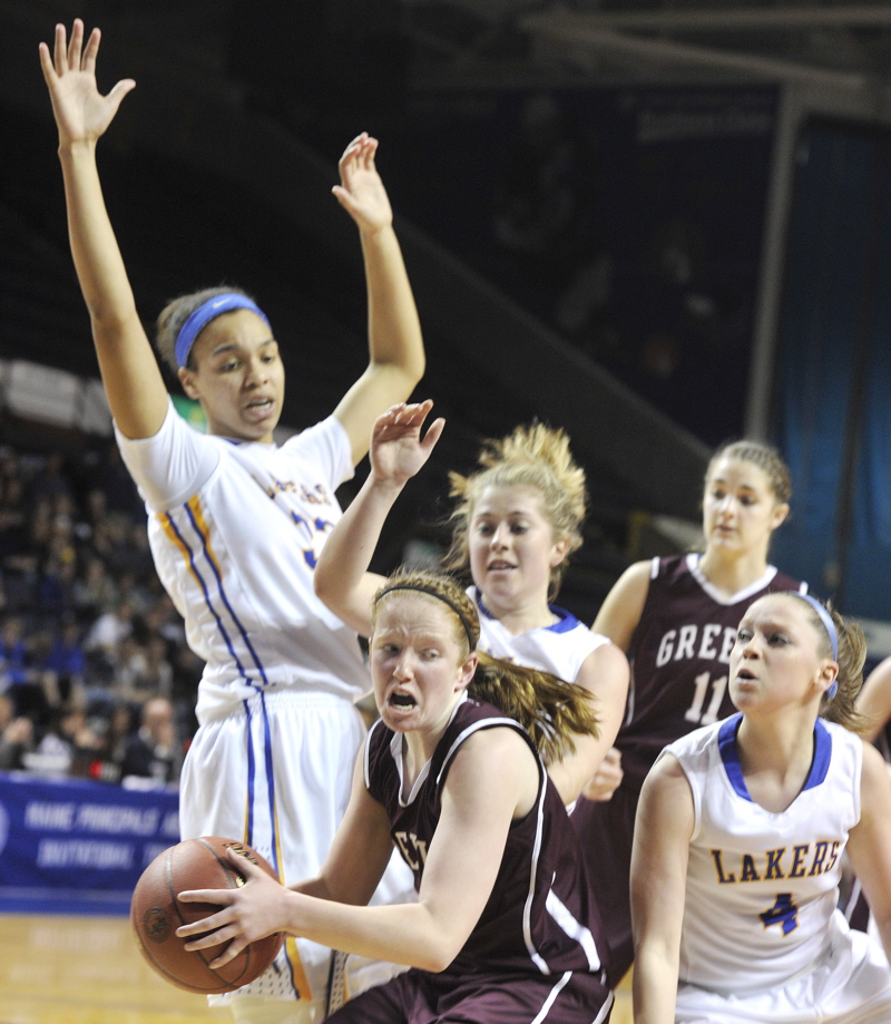 Haley Felkel of Greely is surrounded by Lake Region defenders after coming up with a rebound Thursday in a Western Class B girls' basketball semifinal at the Cumberland County Civic Center. Lake Region, the No. 1 seed, won 42-27.