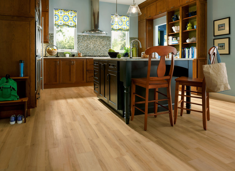 Armstrong’s LuxePlank is a good choice for high-moisture areas and in kitchens, as shown here.