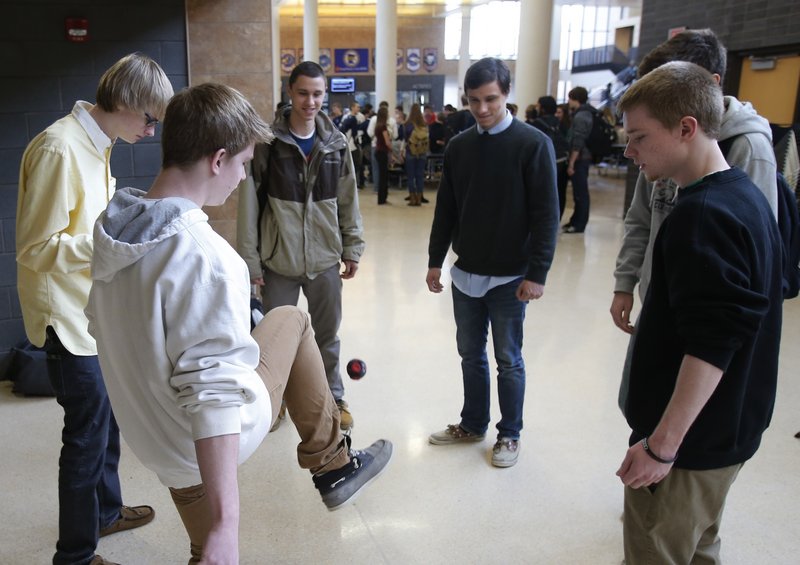 Students play hackie sack to relax during a 20-minute “recess” at Chanhassen High School in Chanhassen, Minn.