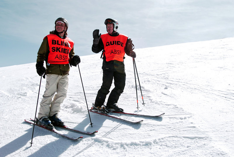 Wally Mozdzierz, left, of Chicago, relies on his guide – this time, Joe Ferrick – to negotiate the slopes and have a full day of skiing despite his vision disability.