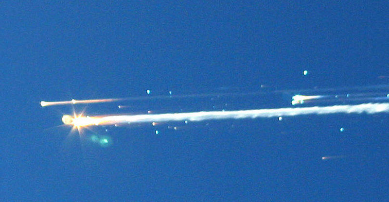 Debris from the space shuttle Columbia streaks across the sky over Tyler, Texas, on Feb. 1, 2003.