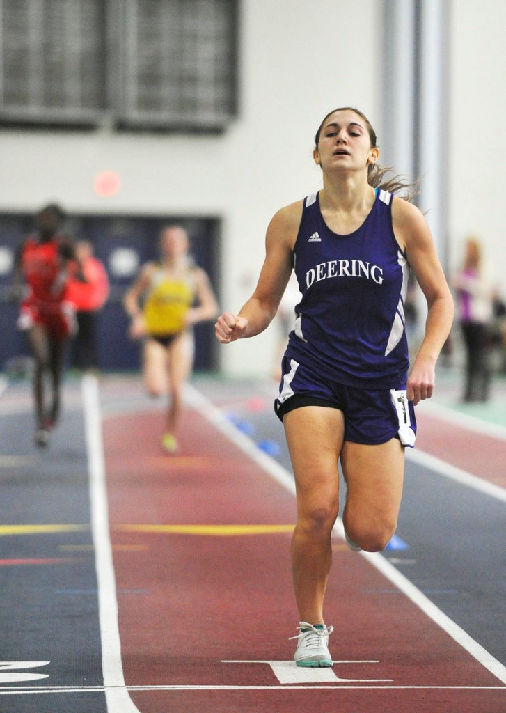 Edie Pallozzi of Deering crosses the finish line to set a record in the girls’ 800 at the Southwesterns, capturing the event in 2 minutes, 19.5 seconds.