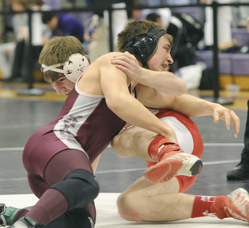 Joe Grenier, left, of Noble and Chase Eldredge of Sanford compete in the 152-pound class at the Western Class A meet.