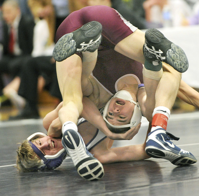Joe Langley of Noble gets an upside-down look at the meet Saturday while being held by Darren LaPointe of Marshwood in their consolation final in the 106-pound class at the Western Class A championships. LaPointe won, 5-0.