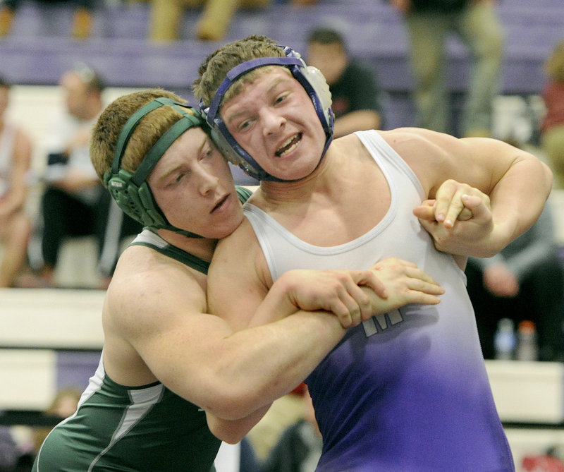 Andy Martel, left, of Bonny Eagle tries to control Tyler Fife of Marshwood in the 195-pound class of the Western Class A regional.