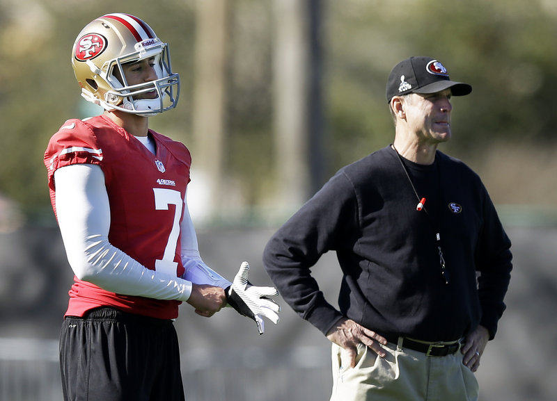 Colin Kaepernick has good reason to stand behind Coach Jim Harbaugh, who named him the 49ers’ starting quarterback in November – a gamble that’s paid off big time.