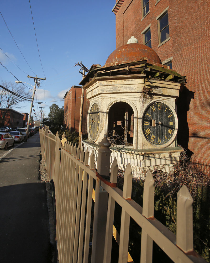 The city of Biddeford is taking the owner of the Lincoln Mill to court over the condition of the clock tower that now rests on the ground and the deteriorating fence in front of it along Lincoln Street in Biddeford.