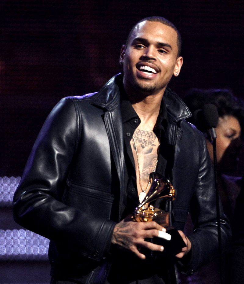 R&B singer Chris Brown accepts a Grammy last year in Los Angeles. He beat Rihanna on the eve of the 2009 Grammy Awards. He is due in court Wednesday for a probation hearing.