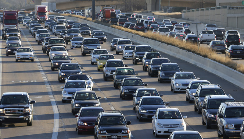 A new report finds that Americans wasted an average of $818 each sitting in traffic in 2011. That also meant more carbon dioxide entering the atmosphere.
