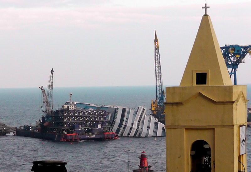 The cruise ship Costa Concordia leans on its side Jan. 11 of this year near the shore of the iisland of Giglio, Italy. Thirty-two people died when the ship ran aground on Jan. 13, 2012.
