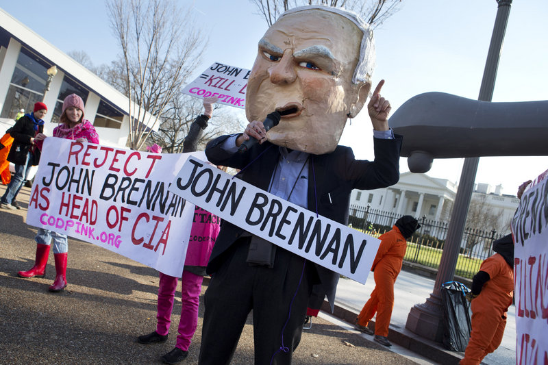 Tighe Barry, wearing a John Brennan mask, takes part in a demonstration in front of the White House last month against President Obama’s choice of Brennan to head the CIA.