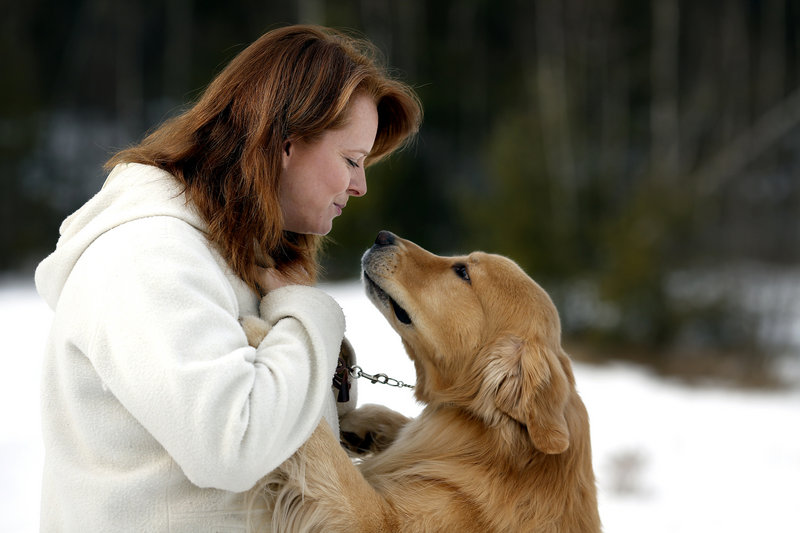 Patty Richards plays with Henry, her 5-year-old golden retriever, at her Jay home.