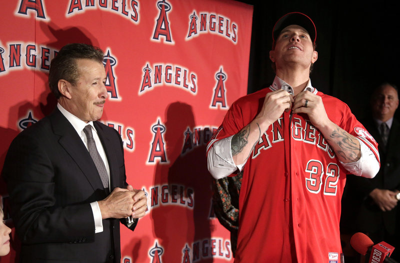 Josh Hamilton, right, was among several high-profile players who switched teams this offseason, moving from the Texas Rangers to their AL West rival, the Los Angeles Angels.