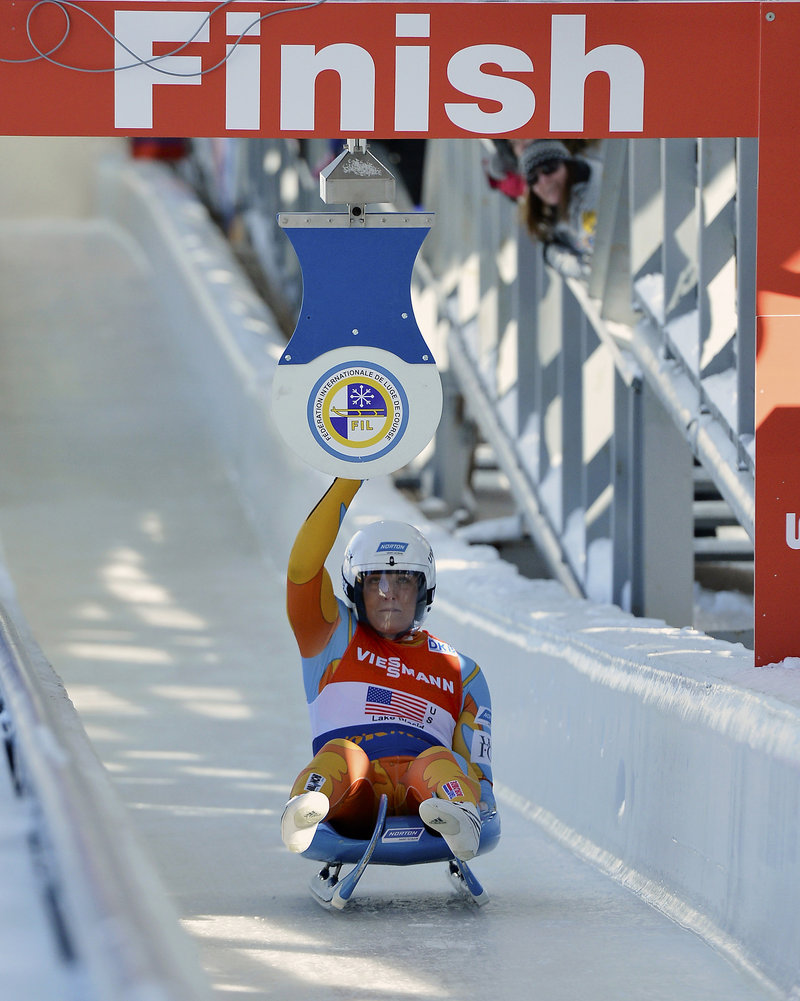 Julia Clukey of Augusta hits the target during the team relay competition at the World Cup luge event in Lake Placid, N.Y., on Saturday. Clukey, racing on her home track, had second-place finishes on consecutive days – moving her up to sixth place in the World Cup standings.