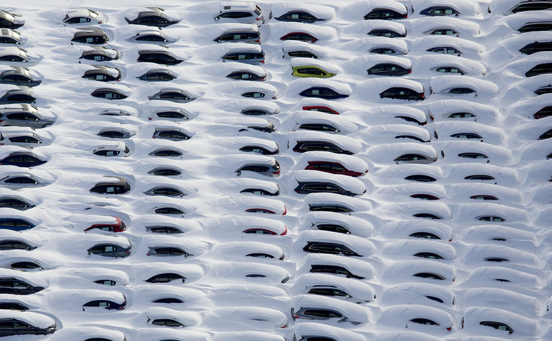Cars sit buried under snow near Hamden, Conn., Sunday in the aftermath of a storm that hit the Northeast.