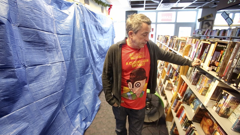 Chris Bowe, co-owner of Longfellow Books in Portland, says that each of the 30,000 books in the store will have to be looked at to see which have suffered water damage after a pipe burst in the bookstore over the weekend.