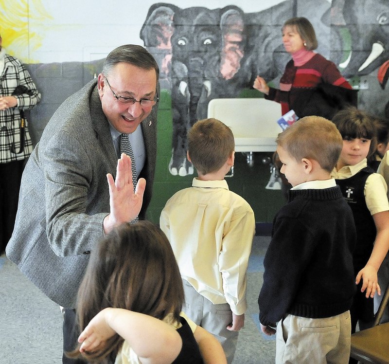 Gov. LePage greets students after reading “Baxter at the Blaine House” at St. John Catholic School in Winslow earlier this month. By criticizing newspapers during his visit to the school, LePage took advantage of the fact that he had an audience that wouldn’t disagree with him, a reader says.