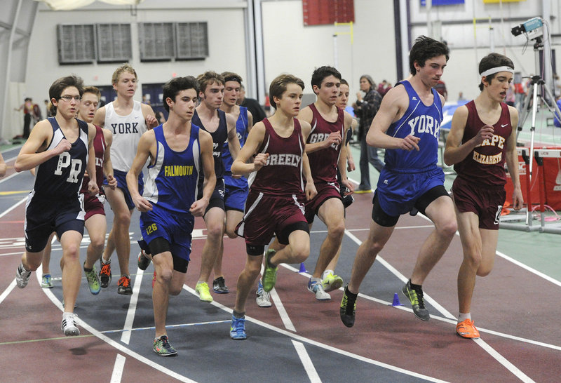 Runners negotiate a turn early in the boys’ mile Monday night at the Western Maine Conference indoor track and field championships in Gorham. The York boys and Greely girls repeated as team champions.
