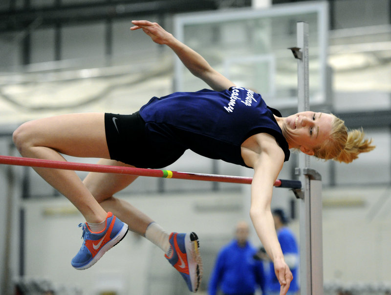 Emily Heggie of Fryeburg Academy goes over the high jump bar at 4 feet, 8 inches. Heggie went on to win the event with a height of 4-10.