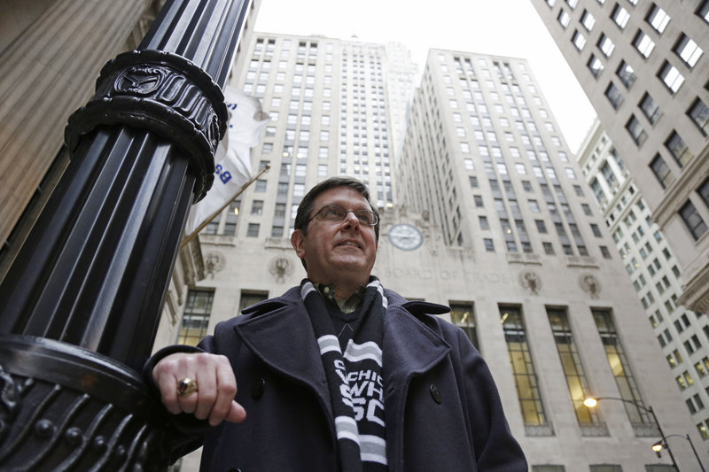 Sean Toohey, a grains broker at the Chicago Board of Trade who had hip replacement surgery last summer, walks home from work Monday. Toohey said he has health insurance so he didn’t ask about the price, but with workers paying higher co-payments and deductibles, more people may start doing so.