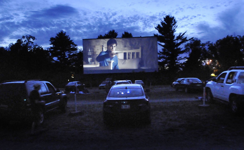 In this July 2011 file photo, cars are lined up to watch the latest Harry Potter movies at the Saco Drive-In. As movie studios move away from 35 mm film and firmly into the digital age, the nation's second-oldest drive-in theater faces the prospect of being left behind.