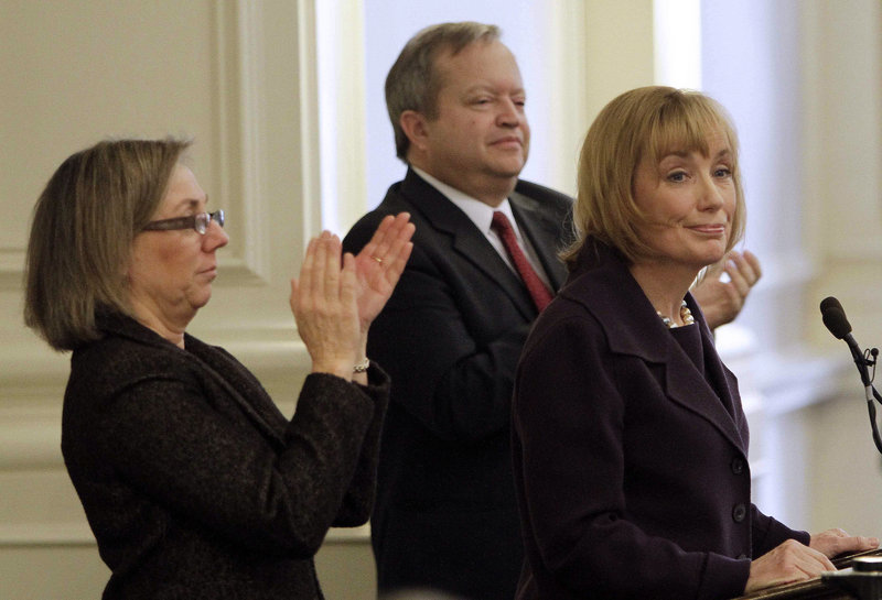 Speaker of the House Terie Norelli, left, and Senate President Peter Bragdon applaud Gov. Maggie Hassan, right., as she delivers her Budget Address at the Statehouse, Thursday, Feb. 14, 2013 in Concord, N.H. (AP Photo/Jim Cole)