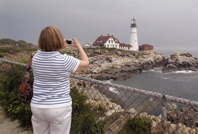 A visitor from Florida takes a picture of Portland Head Light in Cape Elizabeth. Natural beauty is part of what the state stands for, a reader says.