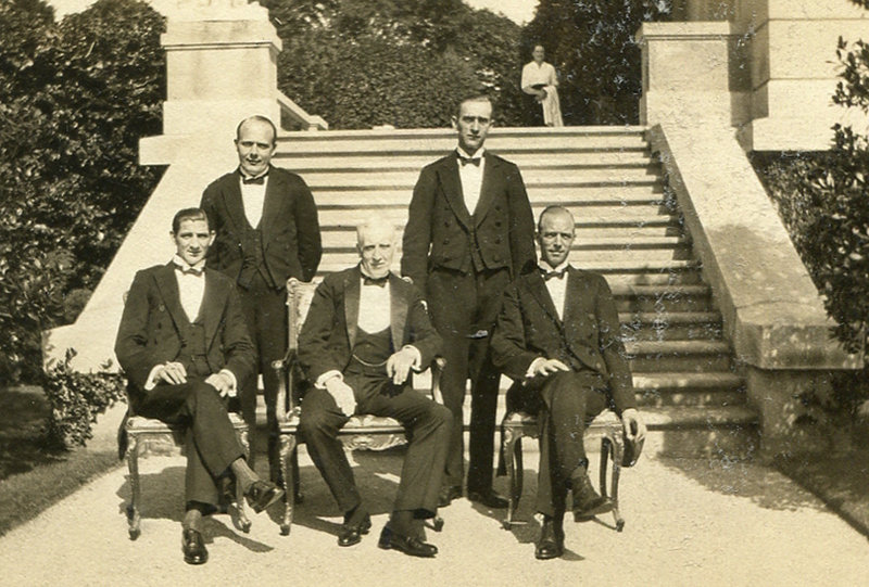 This 1920s image shows butler Ernest Birch, center, surrounded by footmen at The Elms mansion in Newport, R.I. Newly discovered photographs and documents have inspired the creation of a tour about servants at The Elms.
