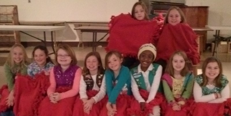 Members of Girl Scout Troop 1714 of Portland pose with red fleece lap blankets they donated to the Teen Shelter in Portland on Valentine’s Day. The girls adopted the shelter as one of their community service projects this year. At Thanksgiving, they donated boxes of food, and for Christmas they filled 16 stockings for the teenagers living at the center.