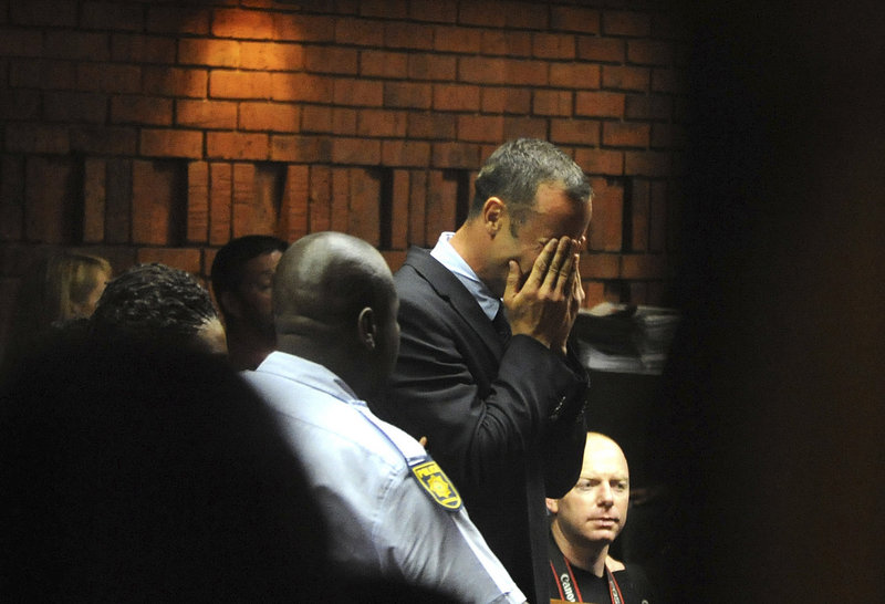Double-amputee sprinter Oscar Pistorius weeps in court in Pretoria, South Africa, at his hearing Friday in the murder case of his girlfriend, Reeva Steenkamp.