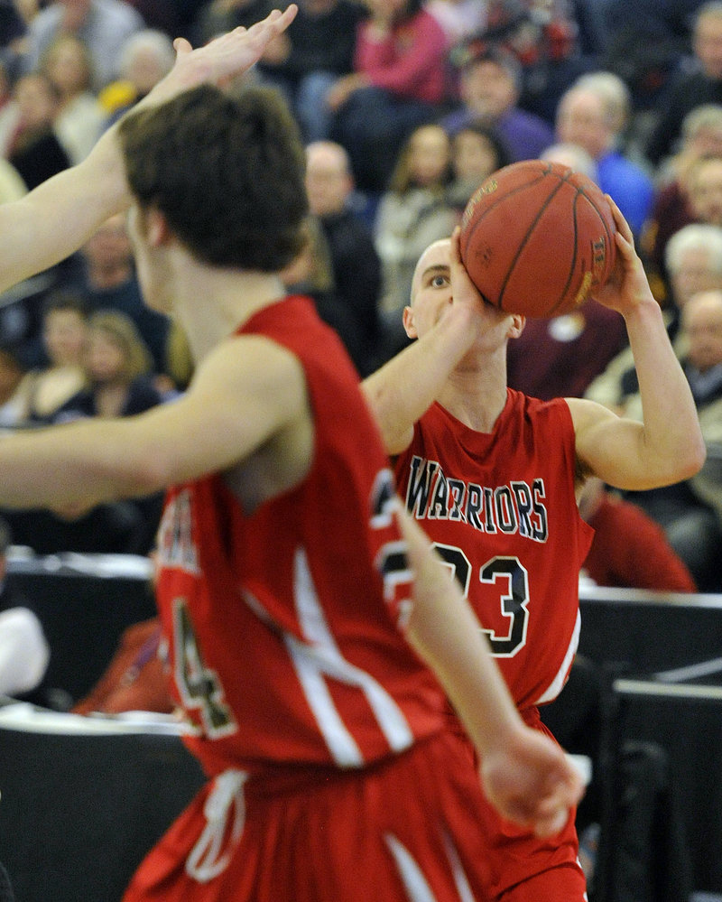 Chris Carney of Wells keeps his focus on the basket before unleashing a 3-pointer against Cape Elizabeth.