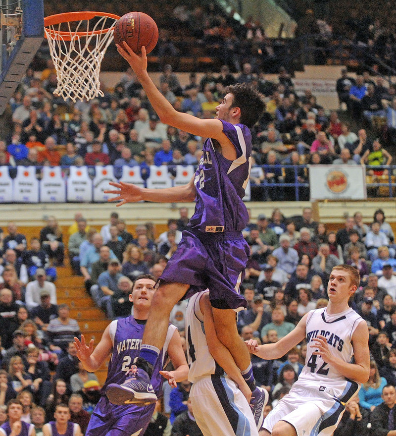 Justin Jabar of Waterville soars to the basket during an Eastern Class B quarterfinal Saturday against Presque Isle, which defeated the Purple Panthers, 47-45.